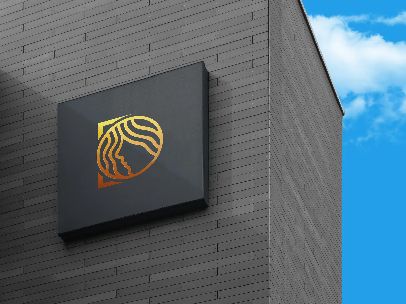 The Dreadit mark in gold gradient on a dark square sign mounted on a brick wall
