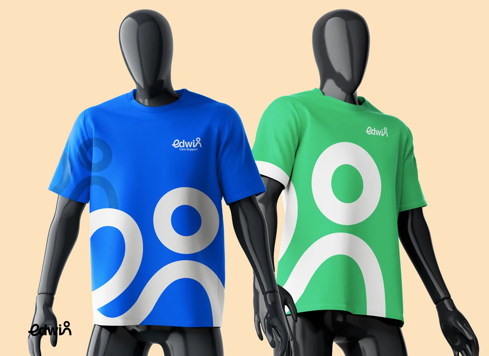 Blue and green Edwin staff tees on mannequins, each carrying a large white figure motif