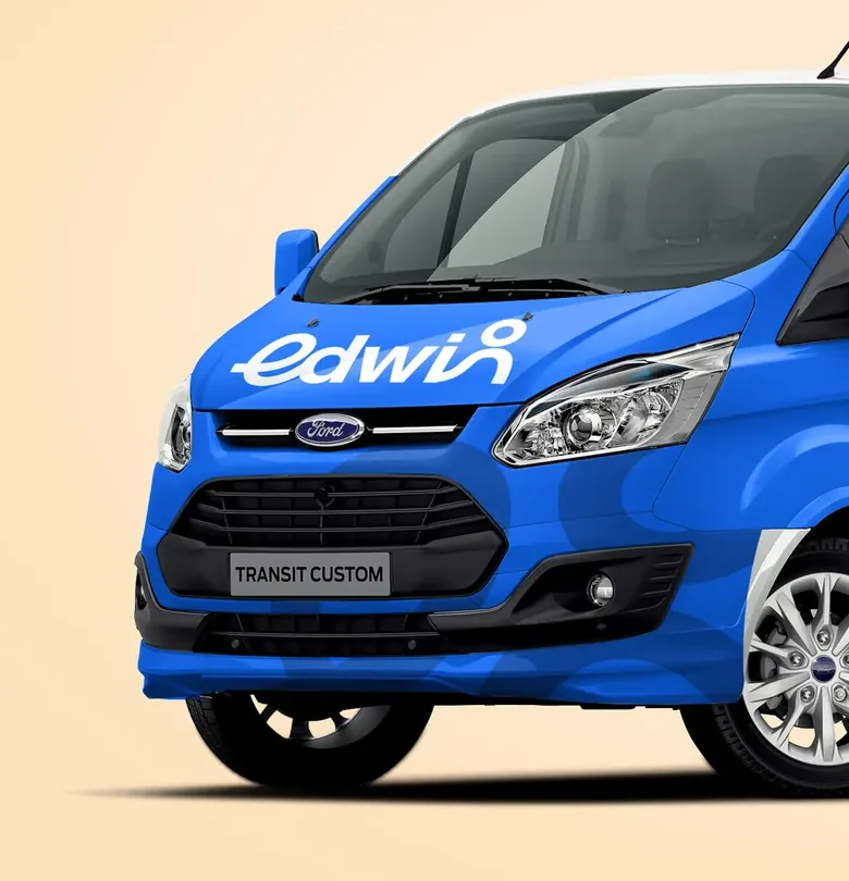 Front of the blue Edwin support van with the edwin logo across the bonnet
