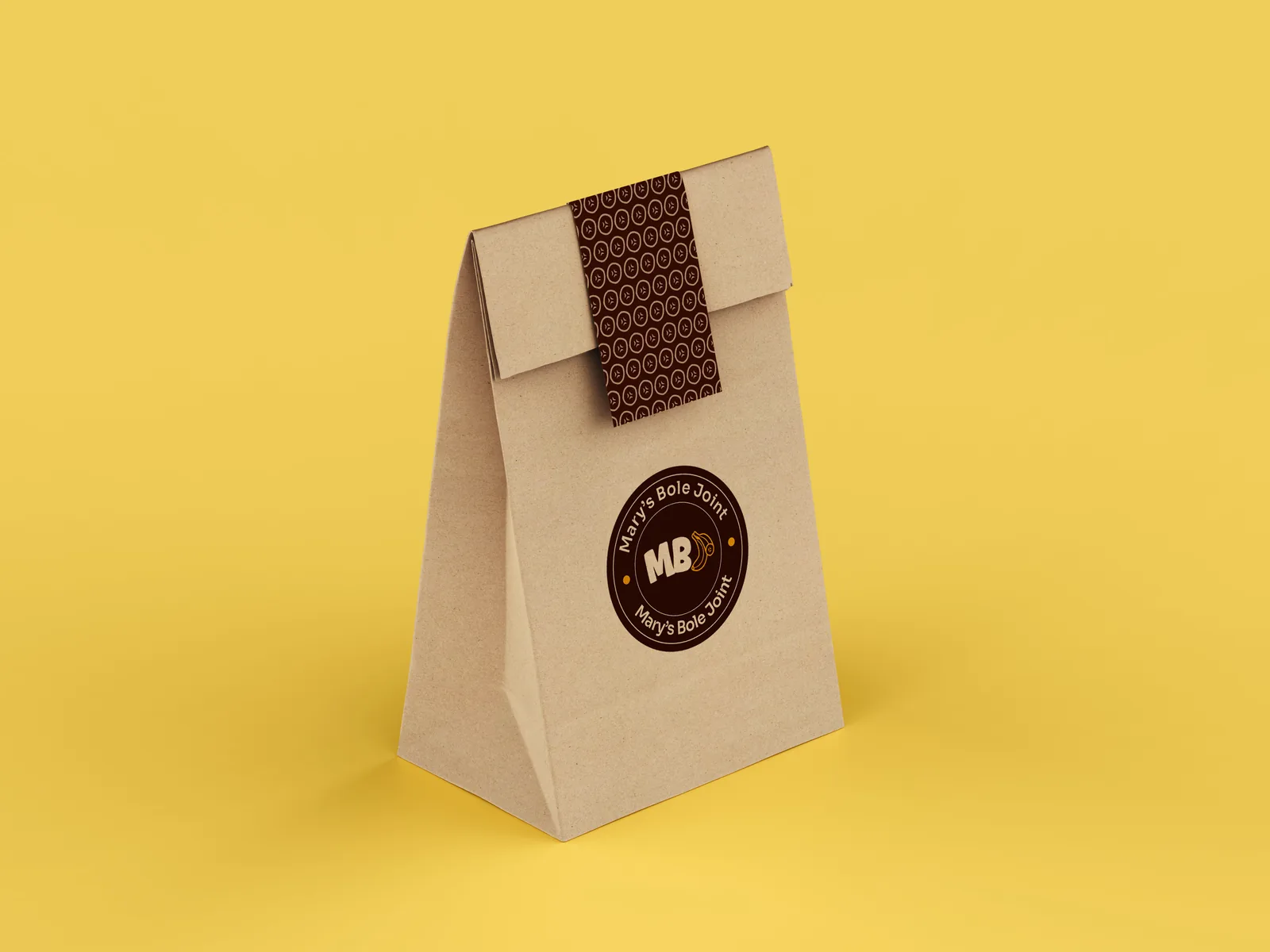 Kraft takeaway bag with a patterned brown band and a round Mary's Bole Joint seal, on golden yellow