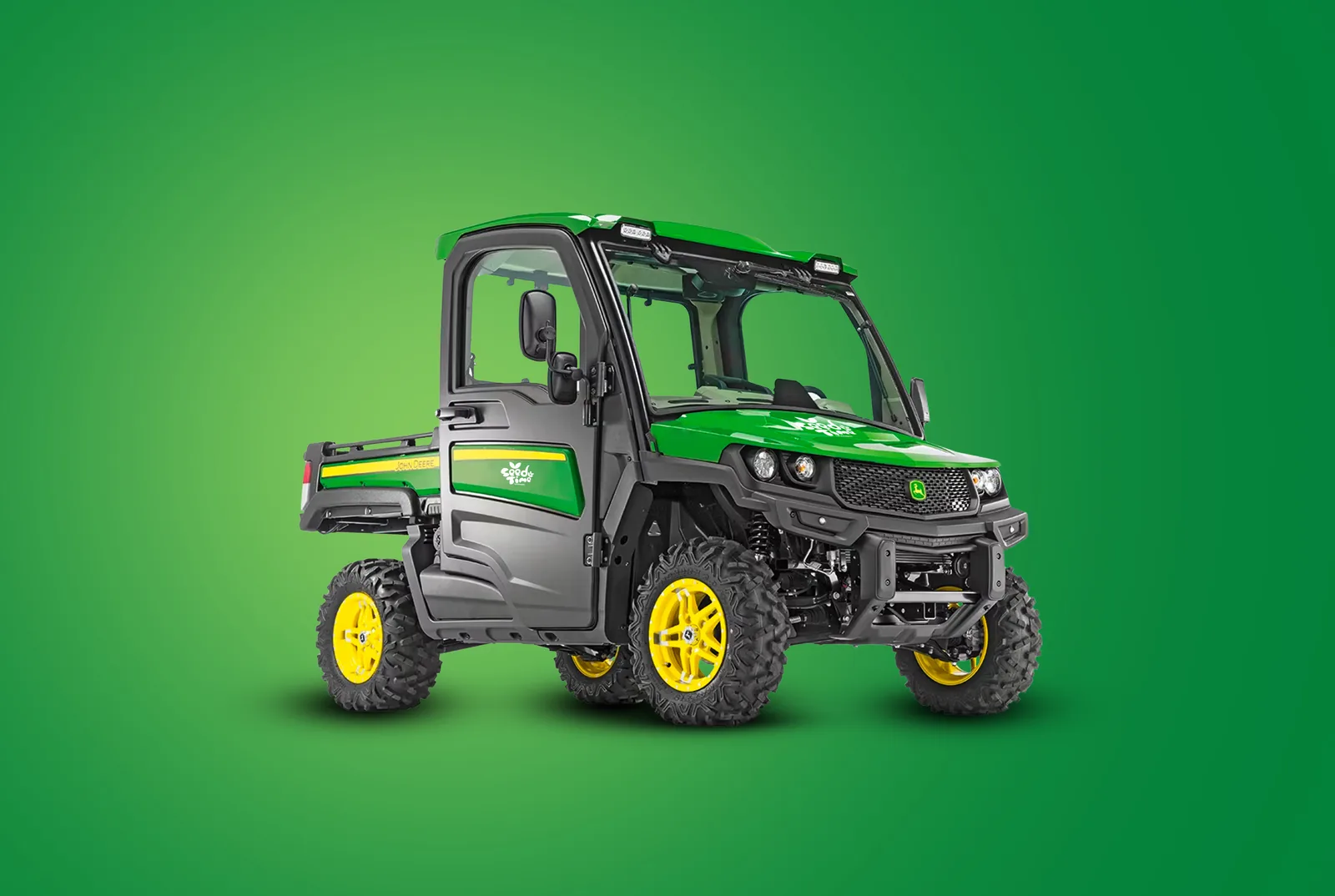 Green utility vehicle on a green backdrop carrying the Seed Time Landscapes mark on the bonnet and door