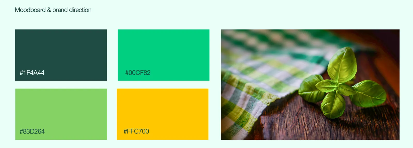 Moodboard: deep green, bright green, leaf green and yellow swatches beside fresh basil on a checked cloth